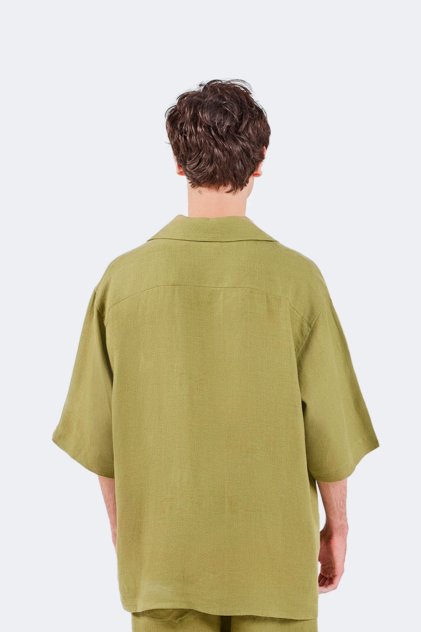 Back detail of the San Cristobal Short-Sleeved Shirt showcasing the clean yoke construction and breathable linen fabric.
