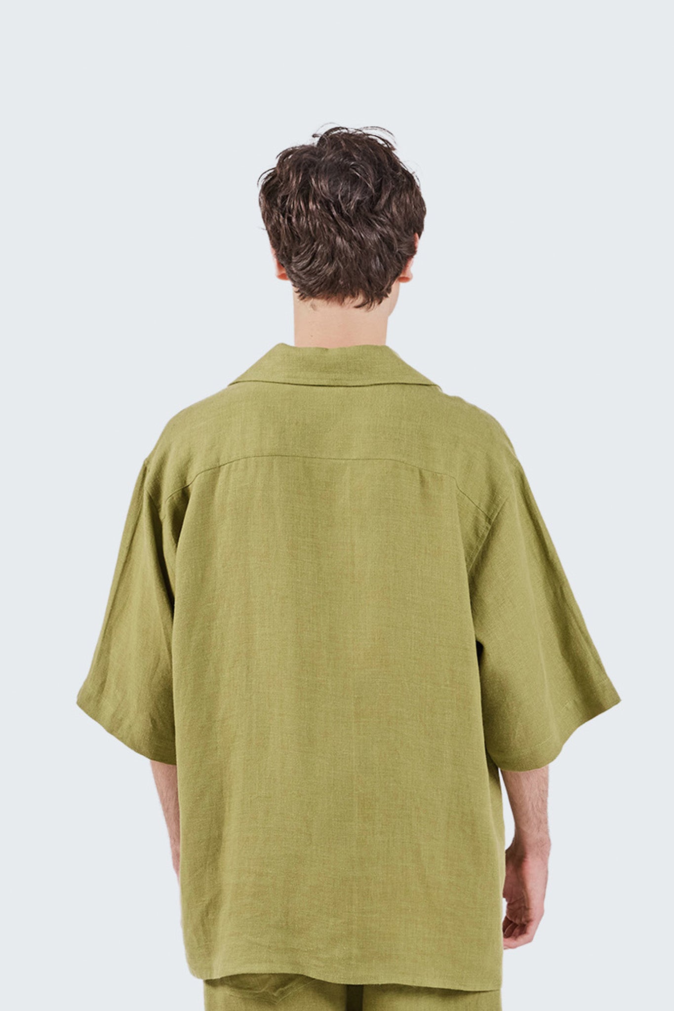 Back detail of the San Cristobal Short-Sleeved Shirt showcasing the clean yoke construction and breathable linen fabric.