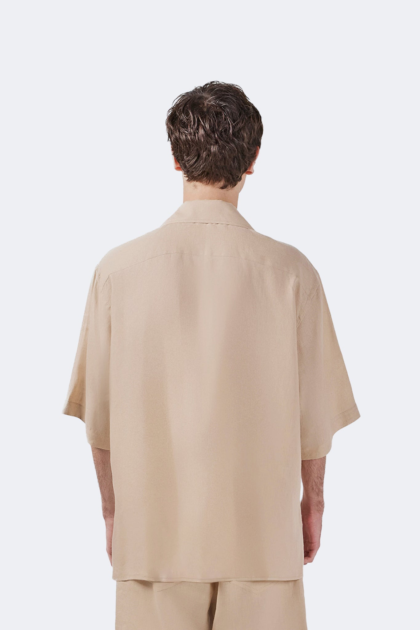 Back detail of the Santa Cruz Short-Sleeved Shirt Ivory showcasing lightweight linen and relaxed tailoring.