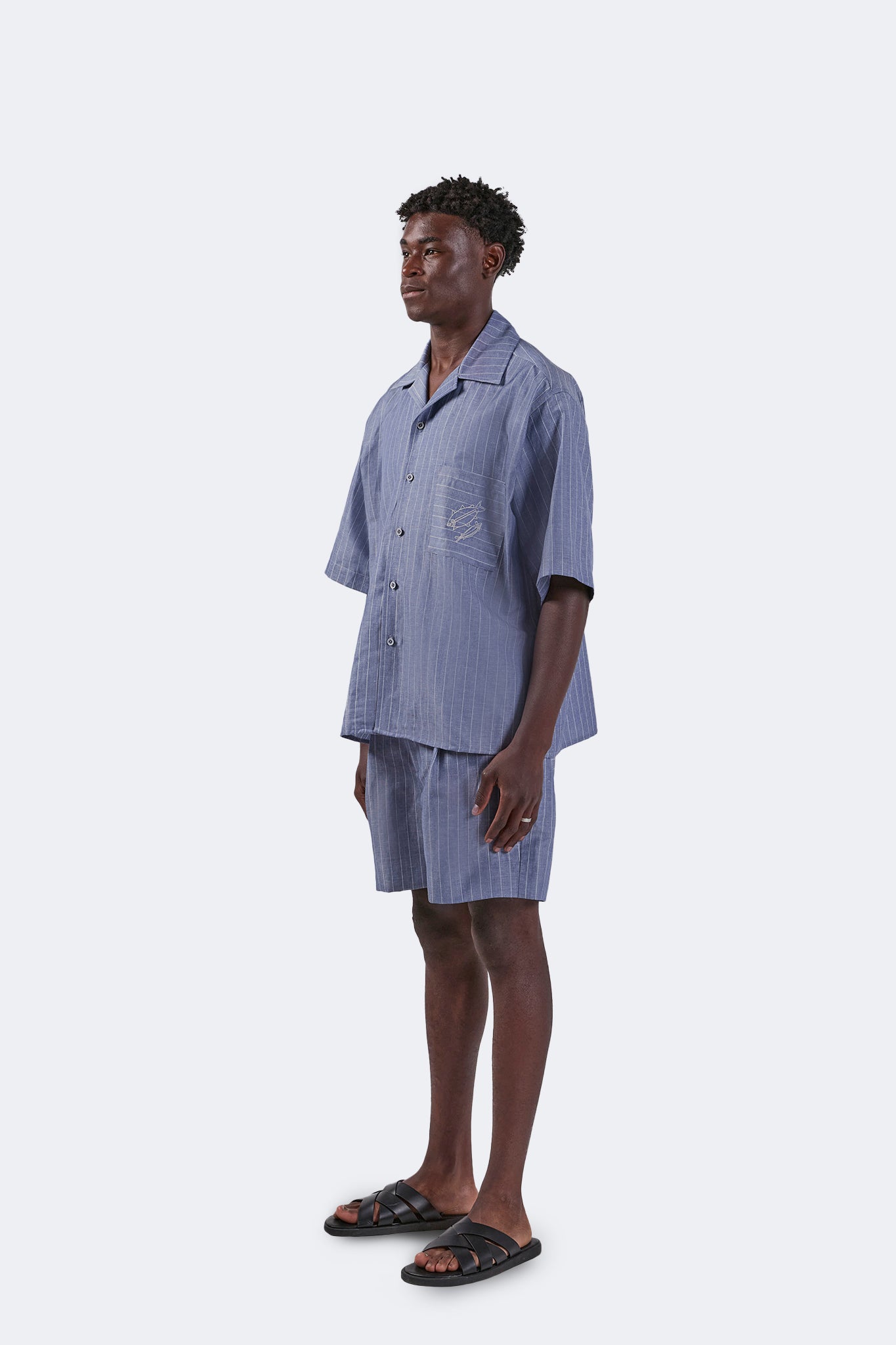 Side view of the Santa Cruz Linen Shorts Indigo highlighting the clean tailoring, lightweight linen construction, and relaxed fit.