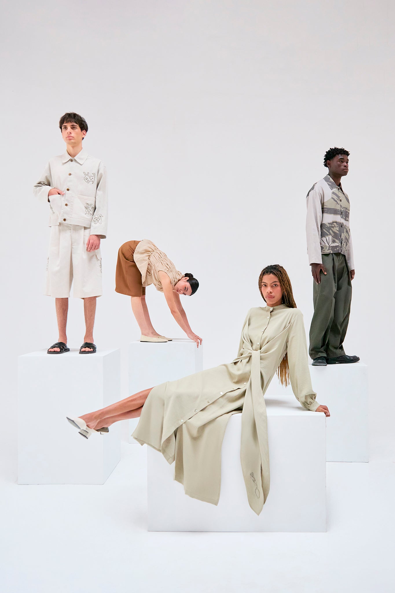 Editorial image featuring Tolita Linen Utility Jacket, Zigze Knotted Dress, Palo Santo Gathered Blouse Ivory and Kikuyo Workman Jacket.
