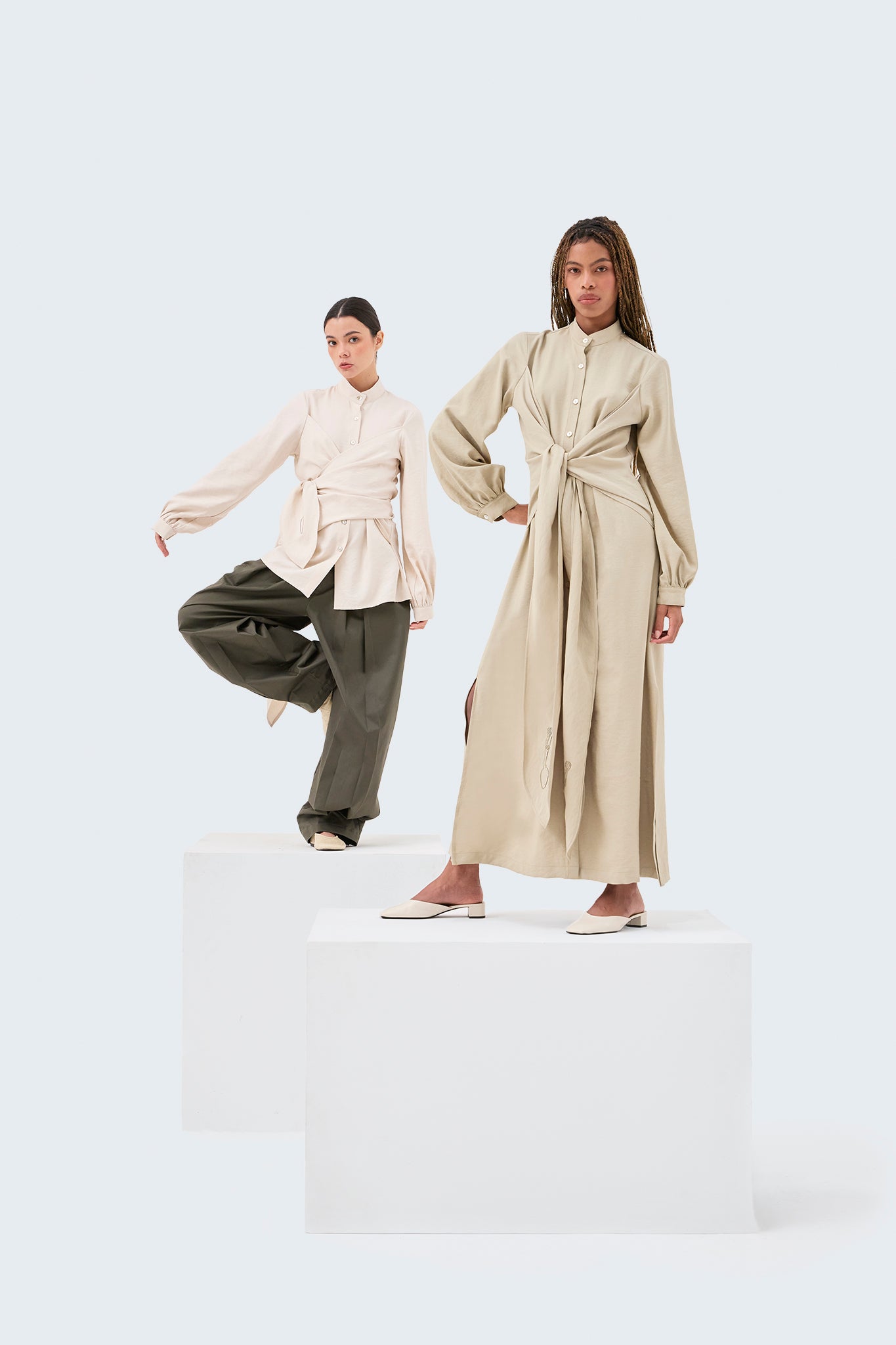 Zigze Knotted Blouse in Off-White with wrap-front detail, knotted sash, and voluminous sleeves.