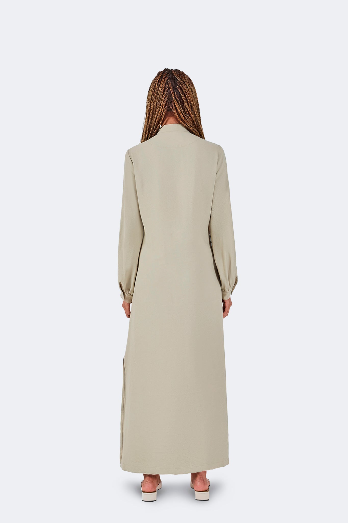 Back view of the Zigze Knotted Dress in Baby Moss featuring a full-length silhouette, soft fluid drape, long sleeves, and clean tailored construction.