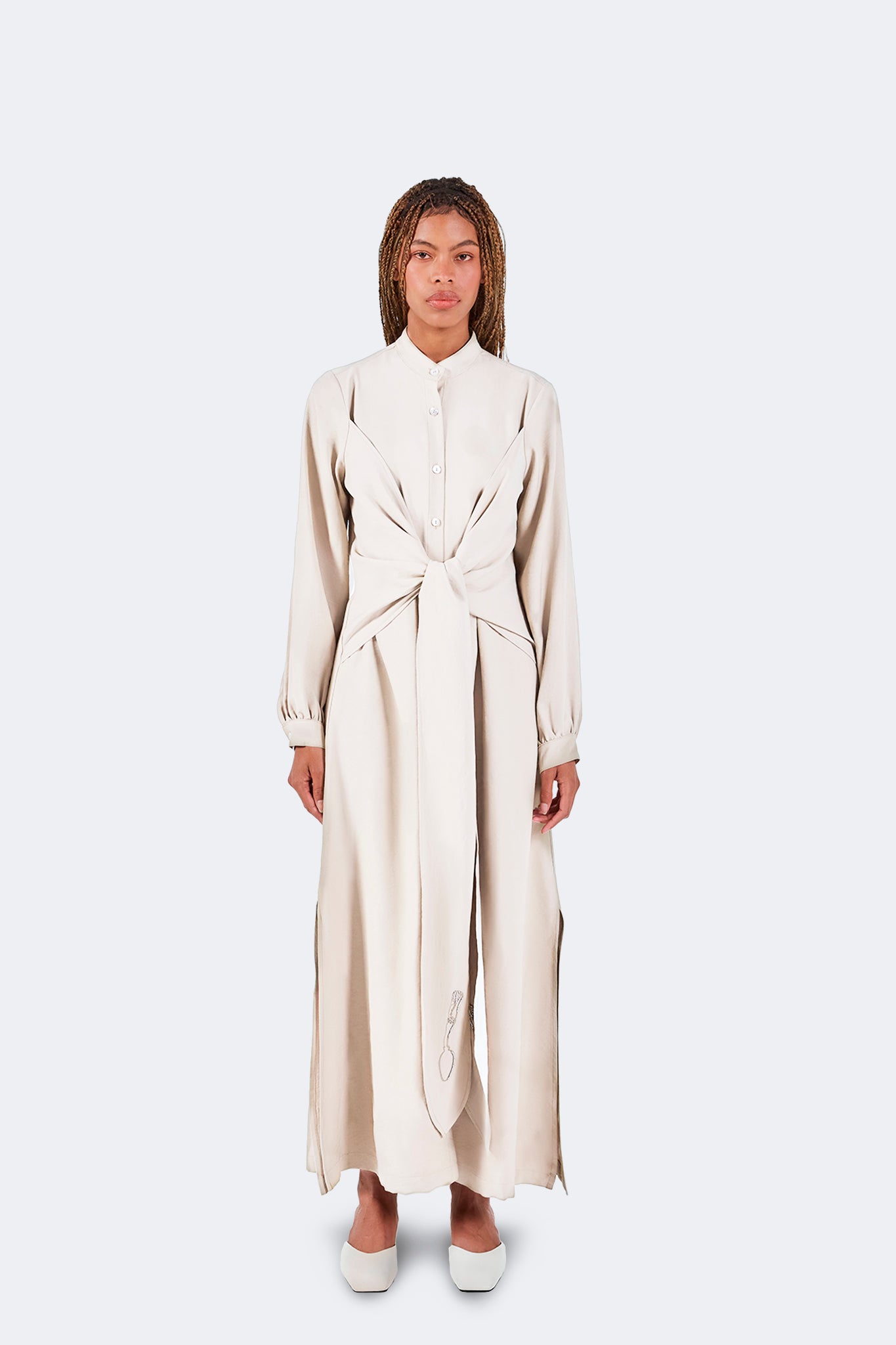 Zigze Knotted Dress in Ivory featuring a full-length silhouette, signature front knot detail, elongated draped ties, and fluid movement.